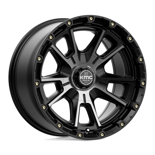 https://assets.wheelpros.com/transform/9d1a0a25-7213-49c6-be72-c5c6ad08fbbe/KM100-17X9-ET-12-Black-Gray-Tint_A1-png?size=500