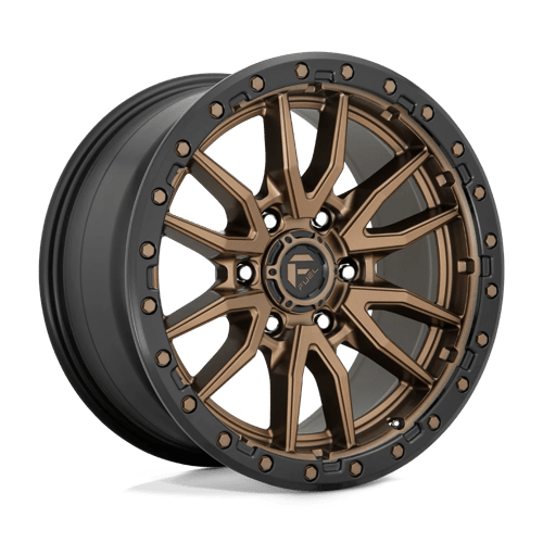 https://assets.wheelpros.com/transform/40089ded-a42e-4aac-a49d-217f41c23763/REBEL-D681-6LUG-18x9-ET20-MATTE-BRONZE-W-BLK-RING-A1-png?size=500