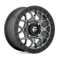 https://assets.wheelpros.com/transform/0aa53d95-c71d-4776-8600-6e459e739635/TECH-D919-4LUG-15x7-ET38-ANTHRACITE-W-BLK-RING-A1-png?size=500